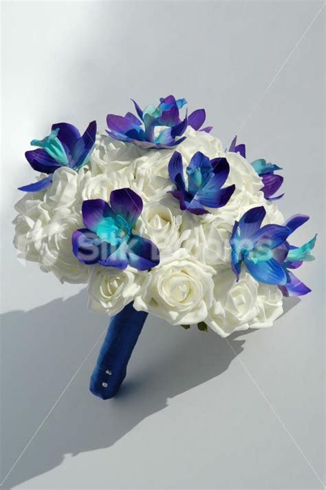 If we had to pick a favorite, then orchid wedding bouquets definitely rank number one for the most create a texture and volume by mixing up your orchids with lilies and roses for an extraordinarily. bridal cascading bouquets in blue galaxy orchids ...
