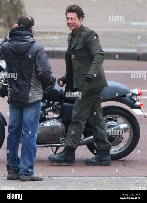 Tom Cruise Rides On A Triumph Motorbike Down The Mall While Filming A Scene From His Movie All