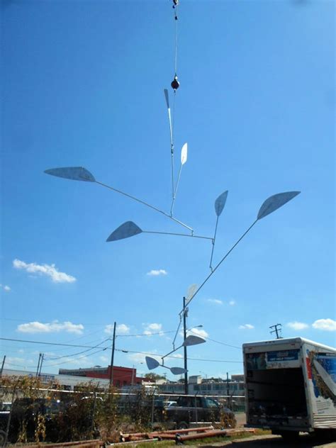 Large Mobile Sculpture Suspended By A Crane For Adjustments