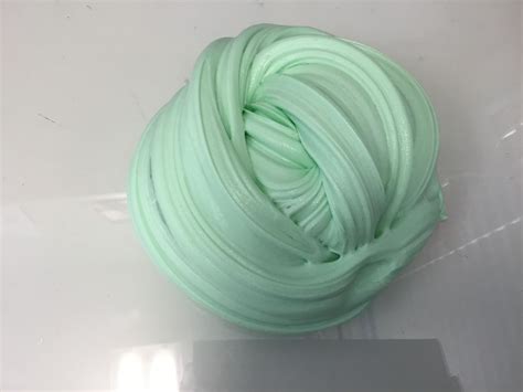 A Ball Of Green Yarn Sitting On Top Of A Table