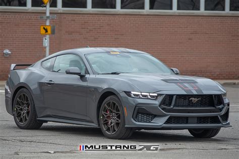 Red And Black Stripes Spied On Carbonized Gray 2024 Mustang Gt Wbronze