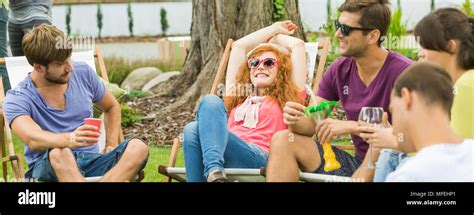 Young Happy People Chilling And Having Drinks In The Countryside Stock