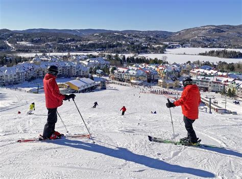 Skiers Admiring Mont And Lake Tremblant Village Resort In Winter Quebec Editorial Stock Image