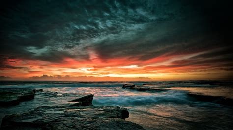 1920x1080 Sunset Sky Rocks Waves Stones Sea Coolwallpapersme
