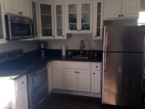 The best kitchen cabinets you can choose for the most important room in your home should possess the ultimate function and style you need. Small corner kitchen with foggy glass doors and stainless ...