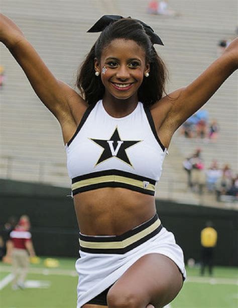 A Cheerleader Is Performing On The Field