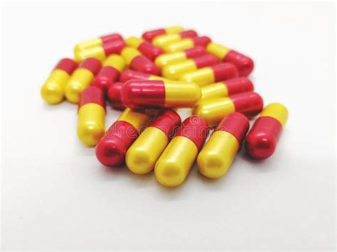Medication And Healthcare Concept Many Red Yellow Capsules Of A Stock