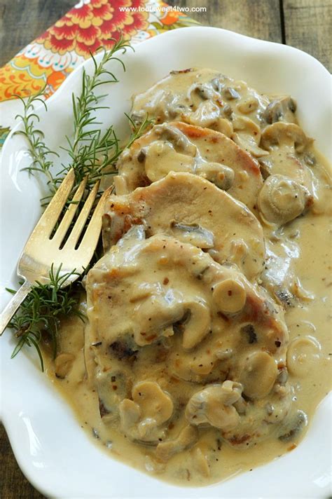 Baked mushroom pork chops ~ seasoned, breaded, and seared before being baked to perfection under a succulent wine and mushroom thyme sauce. Easy Cream of Mushroom Pork Chops | RecipeLion.com