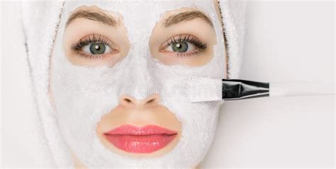 Facial Beauty Treatment Closeup Of Pretty Woman Getting Mask At Spa