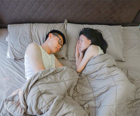 Asian Couple Sleeping On Brown Bed In Bedroom Stock Image Image Of