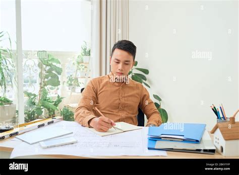 Asian Handsome Male Architect Working In Office Stock Photo Alamy