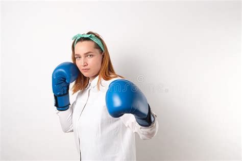 Female Power Concept Boxing Gloves On A Girl In A Dress Stock Photo