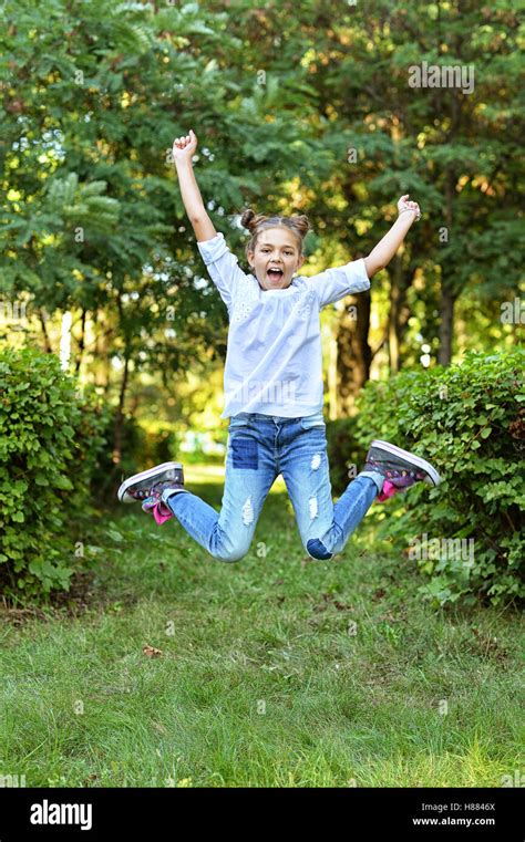 Little Girl Jumps Stock Photo Alamy