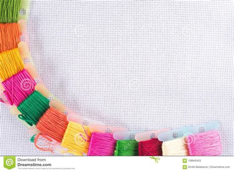 Colored Thread For Embroidery On White Canvas Copy Spase Stock Image