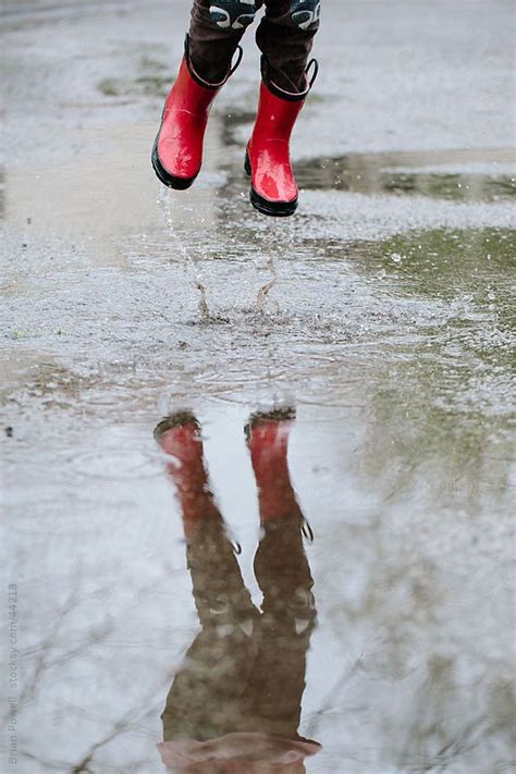 Girl Jumping In Rain Puddle By Brian Powell Person Running Puddle