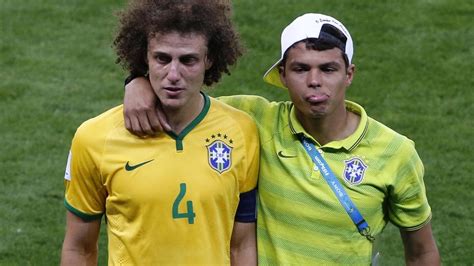 Introdução a engenharia elétrica grupo: David Luiz and Thiago Silva lookalike mascots at Brazil v ...