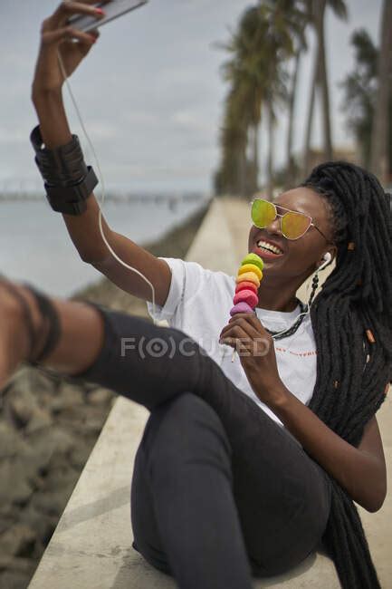 Portrait Of Laughing Woman With Dreadlocks Taking Selfie With Smartphone Maputo Mozambique