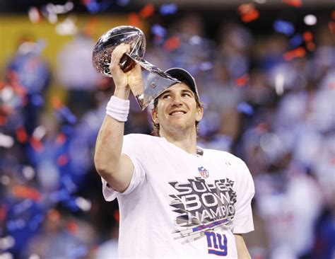 New York Giants Qb Eli Manning Holds The Vince Lombardi Trophy After