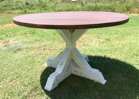 The white legs contrasting with reddish brown top and chairs gives a. Hand Crafted Round Farmhouse Dining Room Table by Boardman ...