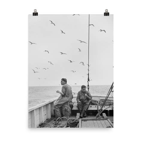 Sea Men On Board The Deck Of A Fishing Boat Out To Sea Near