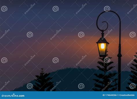 View Of Silhouette Of Classic Street Lamp Post Lighting Against