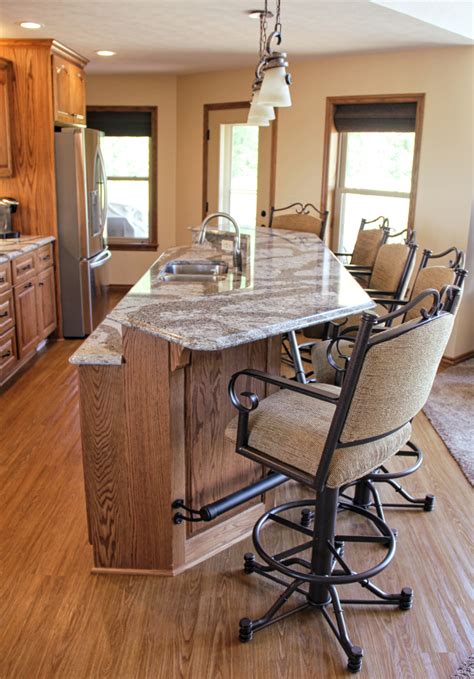 You can match this stain with rustic flooring that has dark, vibrant wood grains. Custom Red Oak Kitchen With Cambria Quartz - Conneaut Lake, PA - Fairfield Custom Kitchens