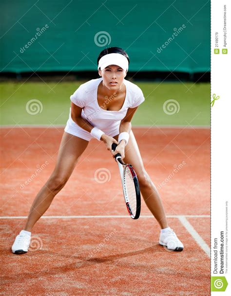 On clay courts balls bounce relatively high and more slowly, making it difficult to hit an outright winner. Female Player Competes At The Clay Tennis Court Stock ...