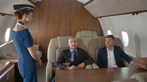 Entrepreneurs In Private Jet Relaxing While Flying And Speaking With