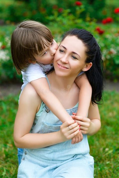 loving son hugging and kissing his happy mother in stock image image of happiness adult 58329869