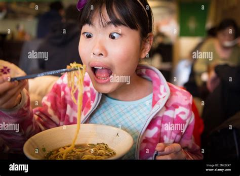 Asian Girl Eating Ramen At A Local Restaurant Stock Photo Alamy