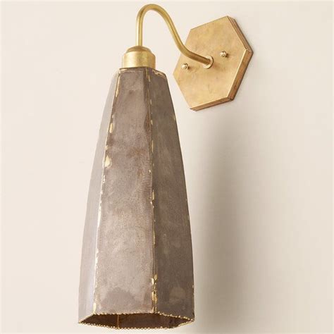 This Strikingly Unique Sconce Has A Hexagonal Body In A Rustic Gray