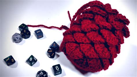 My d&d dice bag design, a sleeping dragon on its hoard of golden treasure, is up for voting on fanforge! DIY Project: Dragon Egg Dice Bag | Geek and Sundry