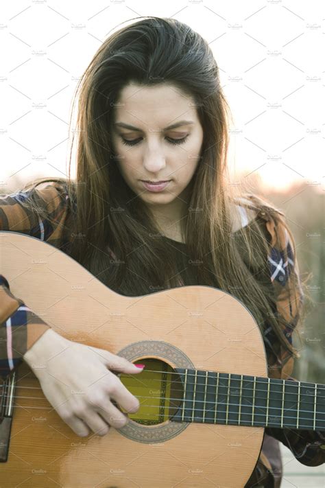 Woman Playing Guitar At Outdoors Featuring Young Relax And Relaxation People Images