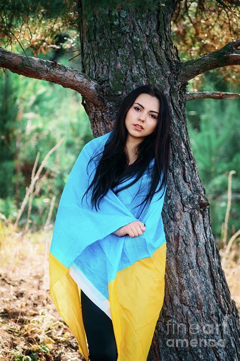 Beautiful Brunette Model Posing In A Park With Flag Of Ukraine