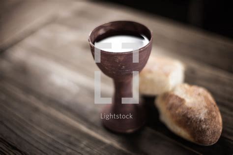 Communion Bread And Wine On A Wood Table — Photo — Lightstock