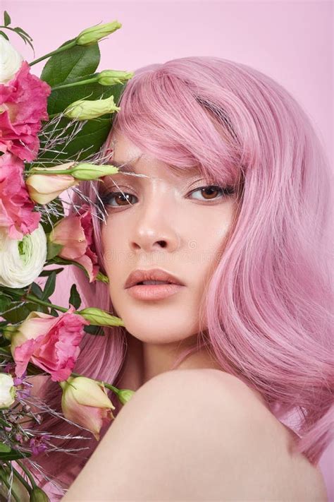 Woman With Colored Pink Strong Hair Holds A Bouquet Of Beautiful
