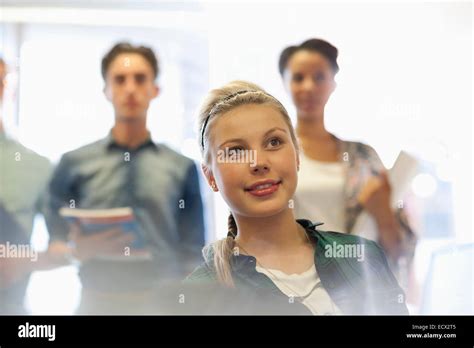 Four Smiling University Students Inside Classroom Stock Photo Alamy