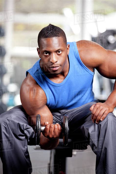 Young Muscular Black Man Lifting Weights In A Gym Stock Photo Dissolve