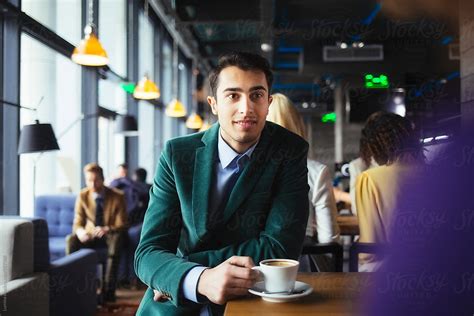 Man Drinking Coffee At A Café By Stocksy Contributor Lumina Stocksy