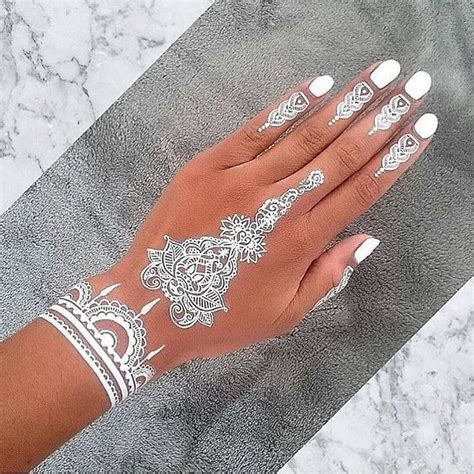 stunning white henna inspired tattoos