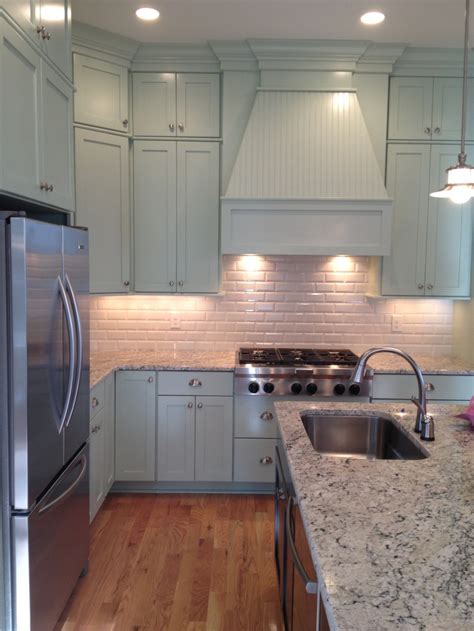 The kitchen island is the element that ties all the other features together and makes. Coastal kitchen. Custom cabinetry to the ceiling, beveled ...