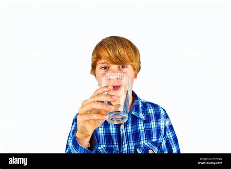 Boy Drinking Water Out Of A Glass Stock Photo Alamy
