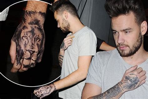 The tattoo is not, in fact, real. Liam Payne shows new lion tattoo on his hand - is it a ...