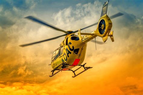 Flying Rescue Helicopter On The Yellow Sky Free Image Download