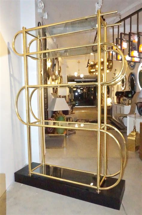 Stanley furniture gold shelf unit restore price $499 cash, credit, or debit. Italian Modern Gold Brass Tubular Shelving Unit Étagère on Black Lacquered Base For Sale at 1stdibs