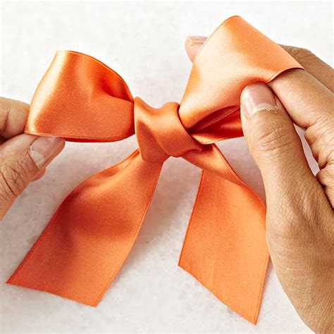 Cut the ends at an angle, this creates a crisp finish and prevents any loose fibers from unraveling. Make a Classic Bow in 4 Easy Steps