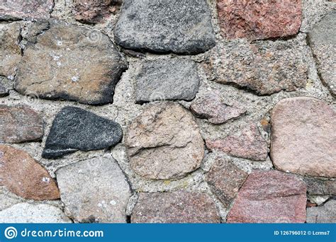 Old Fieldstone Wall Of Field Rocks Full Frame Background Stock Photo