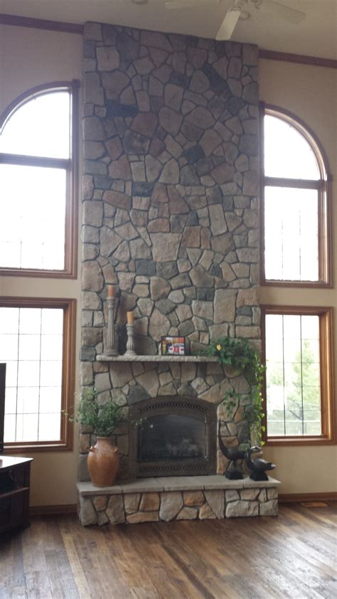 aspen dressed fieldstone by boral cultured stone with limestone mantel and 864 fpx dv gas