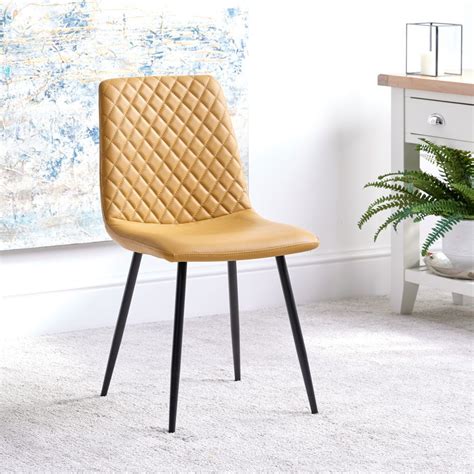 Hand finished metal & hardwood loose foam seat cushion petite ball feet casual and comfortable, this dining chair is the perfect addition to your modern dining room. Ripley Dining Chair - Mustard