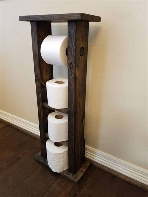 This floor standing tissue holder will match your everyday decor and bring functionality and elegance to your bathroom. FREE SHIPPING Rustic Wood Toilet Paper Holder Stand with ...